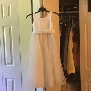 David’s bridal flower girl dress. White with beds on the skirt. Great condition.